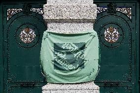 Pilsner Urquell Brewery main gate with a protection face mask