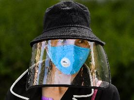 a woman waiting queue to take a sample for a covid-19 test