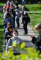 people waiting queue to take a sample for a covid-19 test