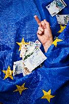 European Union, EU, money, bank notes, currency, EUR, euro, flag, hand, gesture, raised middle finger, banknotes