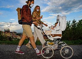 Man, woman, pair, pram, face mask, epidemic, Coronavirus, Prague Castle