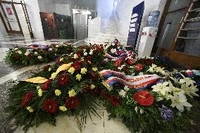 wreaths from Czech state officials lie in the lobby of the Czech Radio building in Prague