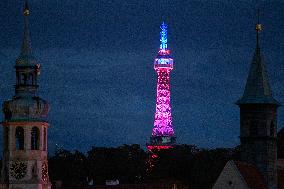 lookout tower on Prague's Petrin Hill shines in colours within the across-the-world gesture Giving Tuesday