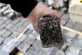 hundreds of cobblestones, made of cut Jewish gravestones, found during a reconstruction of Wenceslas Square