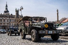 Convoy of U.S. Army World War Two military vehicles, celebrations,