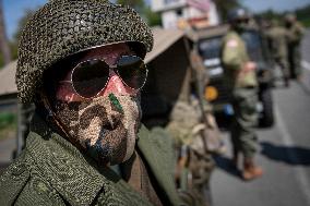 Convoy of U.S. Army World War Two military vehicles, celebrations,