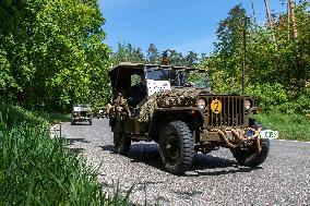 Convoy of U.S. Army World War Two military vehicles, celebrations,