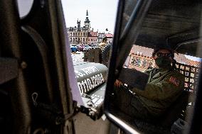 Convoy of U.S. Army World War Two military vehicles, celebrations,