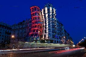 the Dancing House (Fred and Ginger) shines red as part of the Light for AIDS