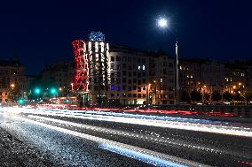 the Dancing House (Fred and Ginger) shines red as part of the Light for AIDS