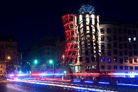 the Dancing House (Fred and Ginger) shines red as part of the Light for AIDS