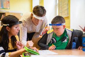 school children, protective shield, return to school, epidemic, pandemic, coronavirus, covid-19