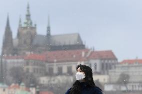 Charle Bridge, Prague Castle, pedestrian with protection face mask