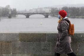 Charle Bridge, Vltava River, pedestrian with protection face mask