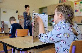 school children, protective shield, return to school, epidemic, pandemic, coronavirus, covid-19