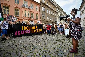 people in Prague protest against police, racial violence, Black Lives Matter, banner together against racism