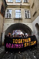 people in Prague protest against police, racial violence, Black Lives Matter, banner together against racism