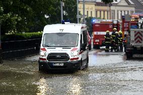 firefighters evacuated the old people's home in Hermanuv Mestec after a nearby pond dam overflowed amid torrential rains