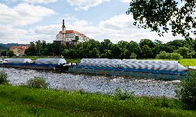 cargo ships loaded of beer tanks for Pilsner Urquell brewery