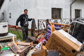people removing damage of local flood