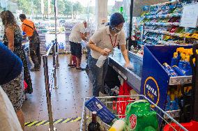 Spar shop cash desk, cashier, a hand disinfection, sprayer disinfectant solution, shopping cart, trolley, supermarke