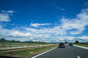 A1 motorway direction to the coastline, highway, low traffic, rideable, almost empty, blue sky, white clouds