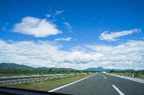 A1 motorway direction to the coastline, highway, low traffic, rideable, almost empty, blue sky, white clouds