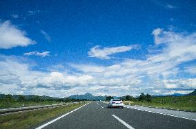 A1 motorway direction to the coastline, highway, low traffic, rideable, almost empty, blue sky, white clouds