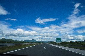 A1 motorway direction to the coastline, highway, low traffic, rideable, almost empty, blue sky, white clouds