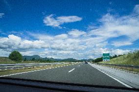 A1 motorway direction to the coastline, highway, low traffic, rideable, almost empty, blue sky, white clouds