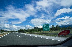 A1 motorway direction to the coastline, highway, low traffic, rideable, almost empty, blue sky, white clouds