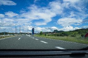 A1 motorway direction to the coastline, highway, low traffic, rideable, almost empty, blue sky, white clouds