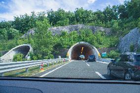 tunnel Krpani, A1 motorway direction to the coastline, highway, low traffic, rideable, almost empty, blue sky, white clouds