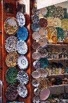 sell of souvenirs, cookware, products from letaher and wood  in medina