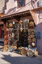 sell of souvenirs, cookware, products from letaher and wood  in medina