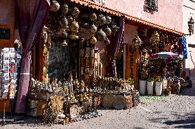 sell of souvenirs, cookware, products from letaher and wood  in medina