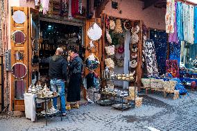 sell of souvenirs, cookware, products from letaher and wood  in medina