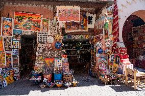 sell of souvenirs, cookware, products from letaher and wood  in medina