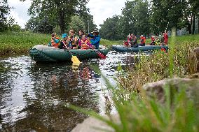 water tourists in a boat on the Orlice river, boats