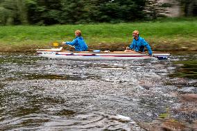 water tourists in a boat on the Orlice river