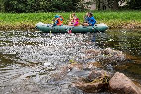 water tourists in a boat on the Orlice river