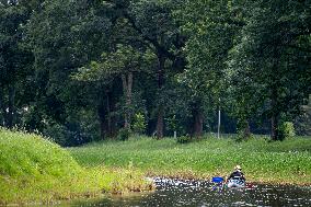 water tourists in a boat on the Orlice river