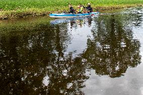 water tourists in a boat on the Orlice river