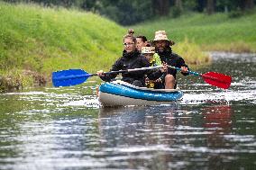 water tourists in a boat on the Orlice river