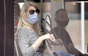 Woman face mask, public transport