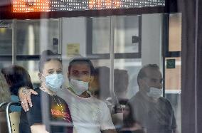 Woman and man, pair, couple, face mask, public transport