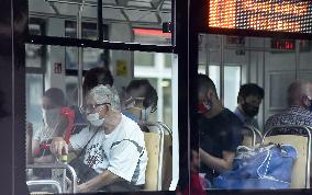 Man, face mask, public transport