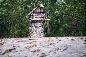 curious wooden hut on the pillar of the bridge of a former branch line
