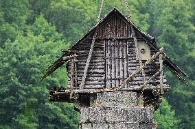 curious wooden hut on the pillar of the bridge of a former branch line