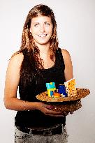 young woman with a hat and sun creams